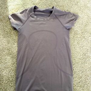 I am selling a purple Lululemon swiftly tech shirt